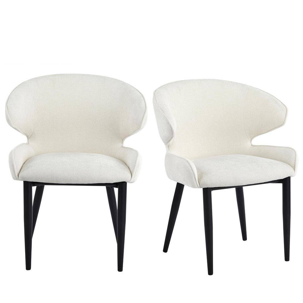 Two beige upholstered modern dining chairs with black metal legs against a white background.