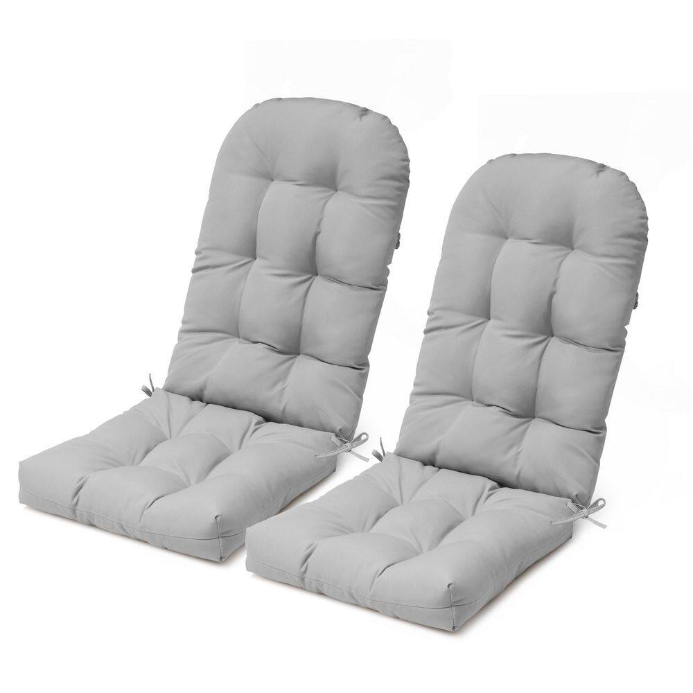 Two grey patio seat cushions laid out on a white surface.