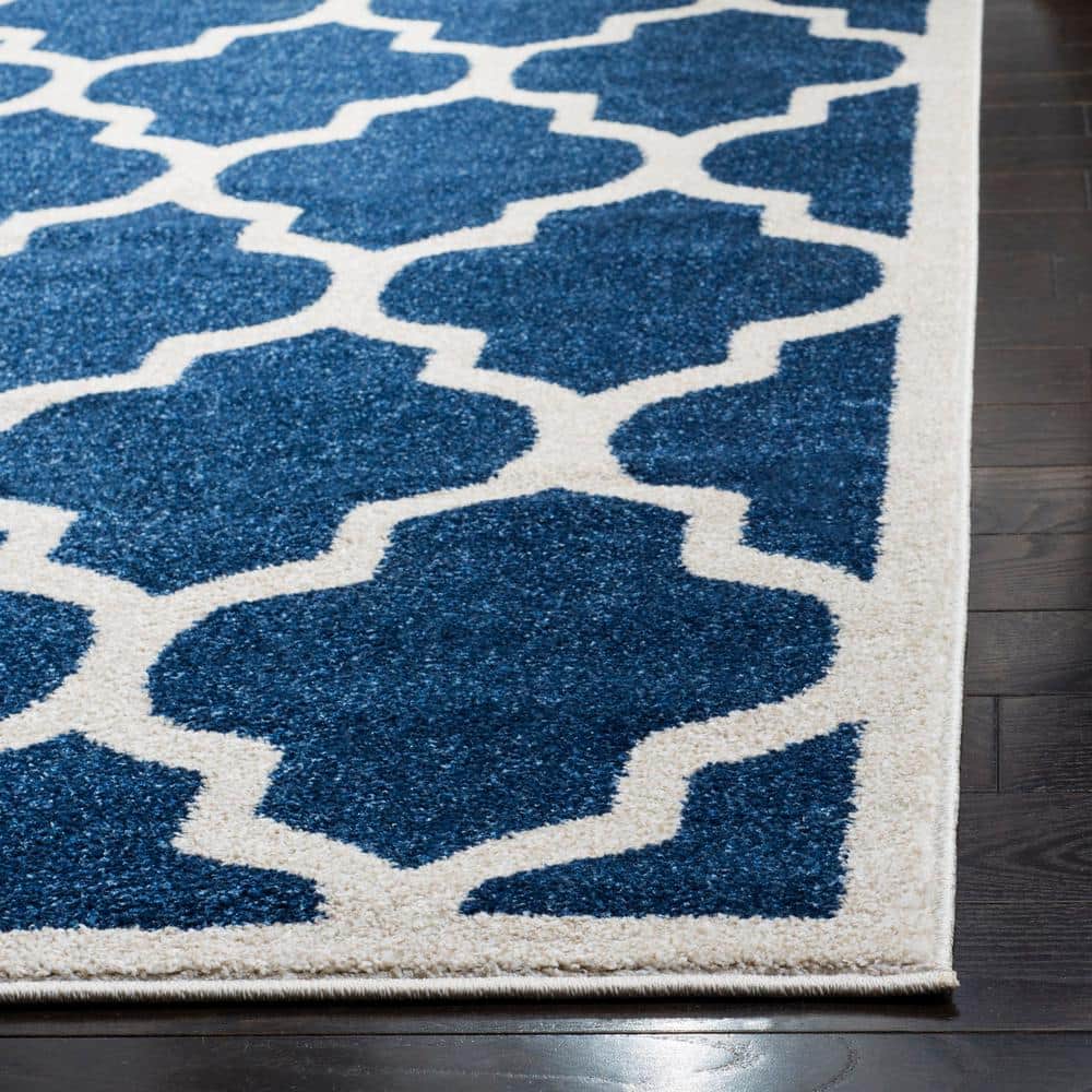 Reversible Geometric Navy and Beige 5' x 8' Synthetic Area Rug