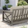Rear view of a three-seater outdoor sofa showing the gray frame and vertical slats.