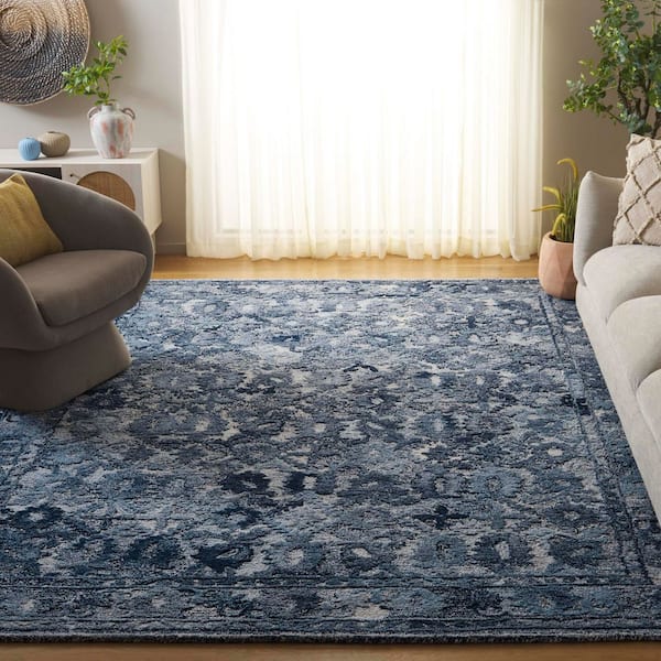 Marquee 9 ft. x 12 ft. Navy Abstract Border Area Rug