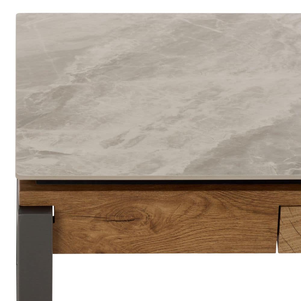 Close-up detail of the stone top and wooden drawer of a coffee table.