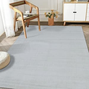 Ivory/White 9 ft. x 12 ft. Solid Handmade Urban Area Rug