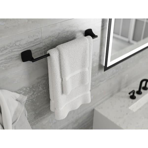 Only unused wall in the bathroom so stacked the towel bars. Matte