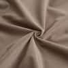 Close-up of mocha velvet fabric texture.