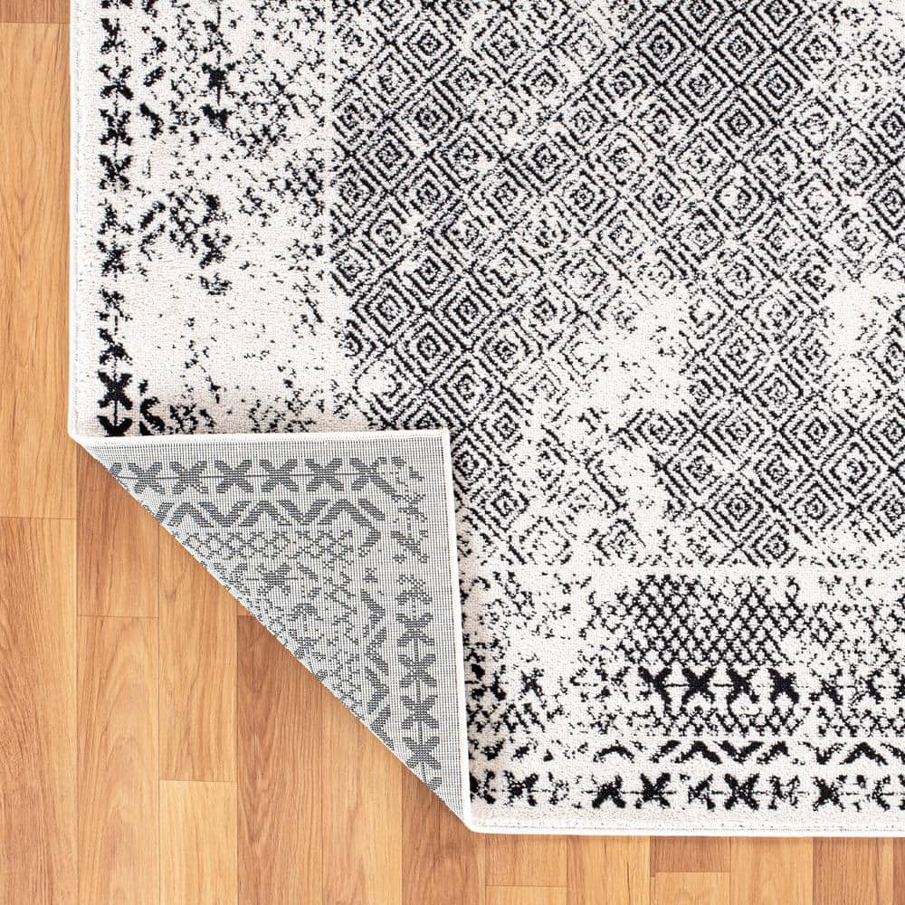 Black Geometric 5' x 7' Synthetic Easy Care Area Rug