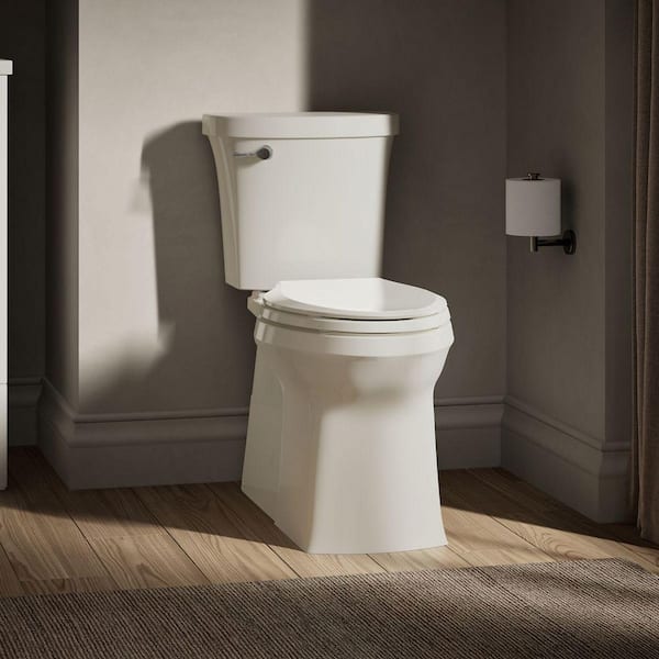 Valiant 12 in. Rough In 2-Piece 1.28 GPF Single Flush Elongated Toilet in Biscuit Seat Included