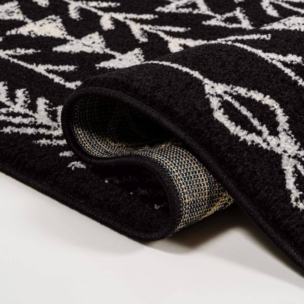 3' x 5' Black and Cream Synthetic Moroccan Geometric Area Rug