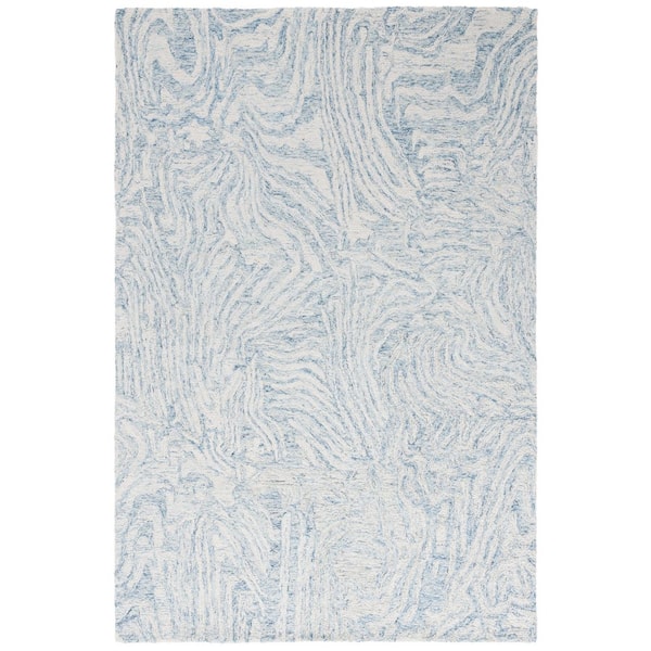 Ebony 6 ft. x 9 ft. Ivory/Light Blue Swirls Abstract Area Rug