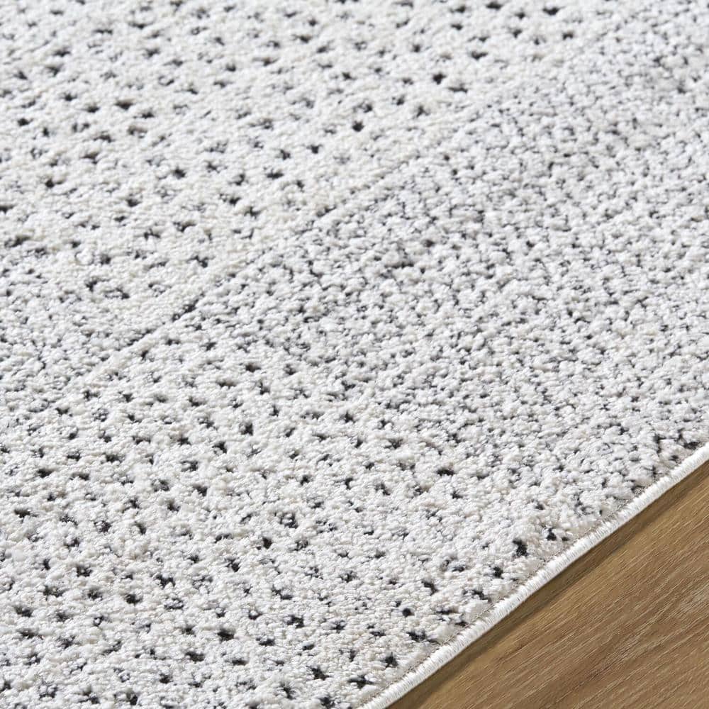 Livabliss 8' x 10' Ivory and Black Synthetic Patchwork Area Rug