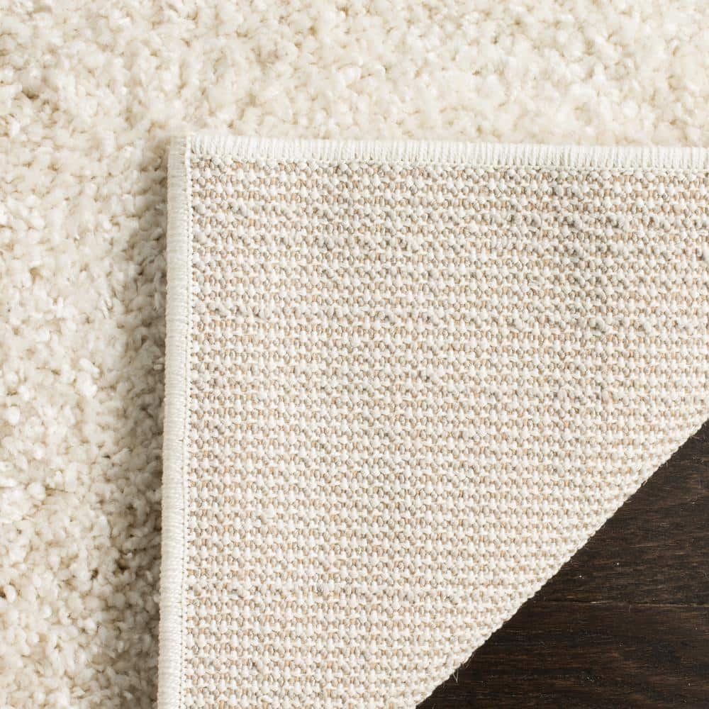 Cream 8' x 10' Tufted Shag Area Rug