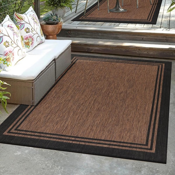 https://images.thdstatic.com/productImages/3ef792a9-0715-4285-961e-415b4a165d0a/svn/gold-black-outdoor-rugs-hd-alh60253-5x7-1f_600.jpg