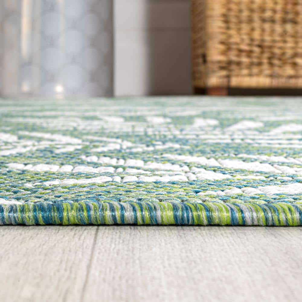 4' x 6' Green and Cream Synthetic Palm Frond Area Rug