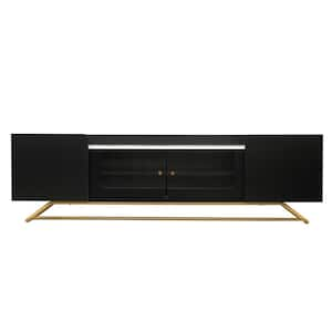 Modern Black TV Stand Fits TV's up to 70 in. with Fluted Glass, Gold Frame Base