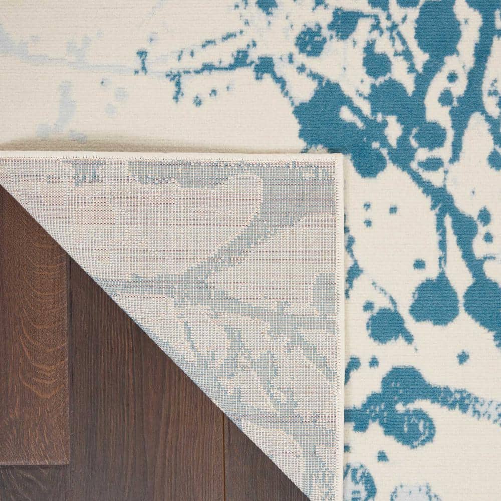 Ivory and Blue Abstract Synthetic 4' x 6' Easy-Care Area Rug