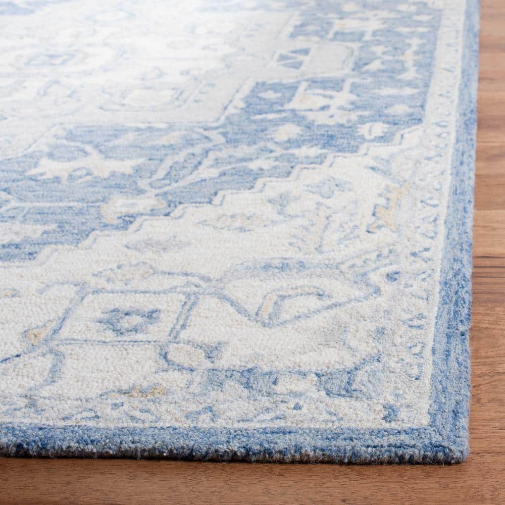 Handmade Blue and Ivory Wool 4' x 6' Tufted Area Rug