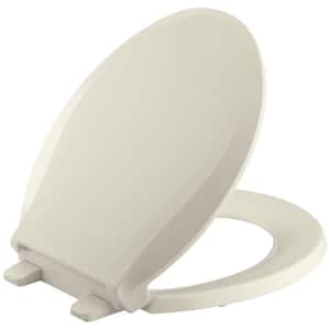 Cachet Quiet-Close Round Closed Front Toilet Seat with Grip-Tight Bumpers in Almond