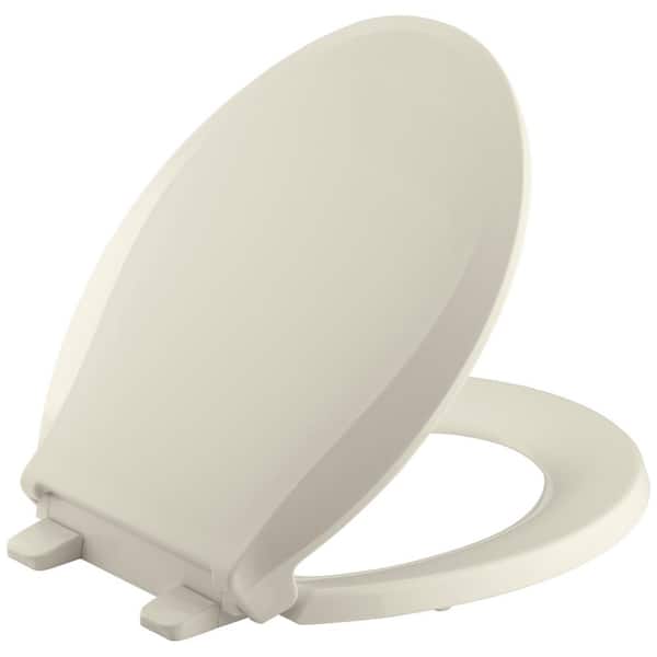 KOHLER Cachet Quiet-Close Round Closed Front Toilet Seat with Grip-Tight Bumpers in Almond