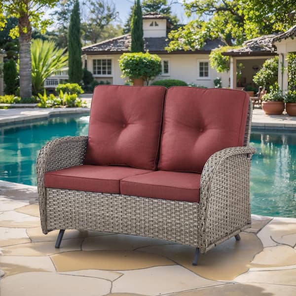 SleekArm Gray PE Wicker Outdoor Glider Loveseat with Red Cushions and Glide Function
