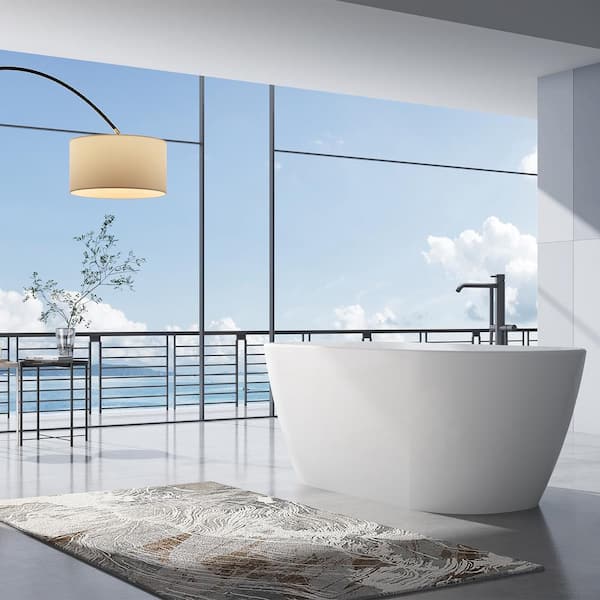 Modern bathroom with freestanding bathtub, modern taps and blue