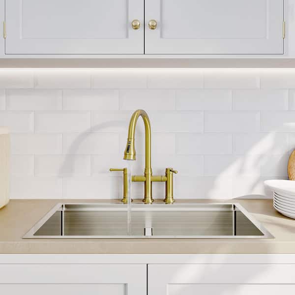 Double Handle Bridge Kitchen Faucet with Pull Down Spray Head in Brushed Gold