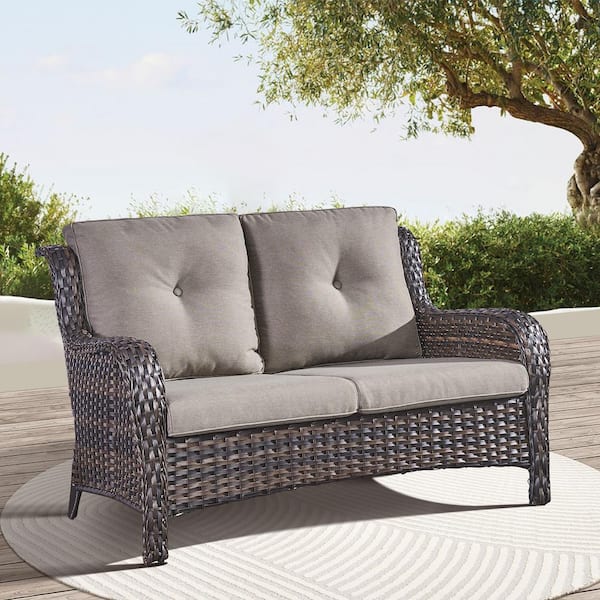 Brown PE Wicker Outdoor Loveseat with Gray Cushions and Curved Armrests