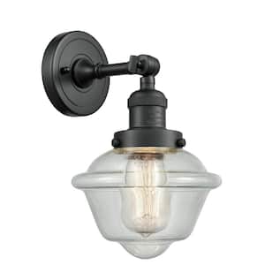 Franklin Restoration Small Oxford 7.5 in. 1-Light Matte Black Wall Sconce with Seedy Glass Shade