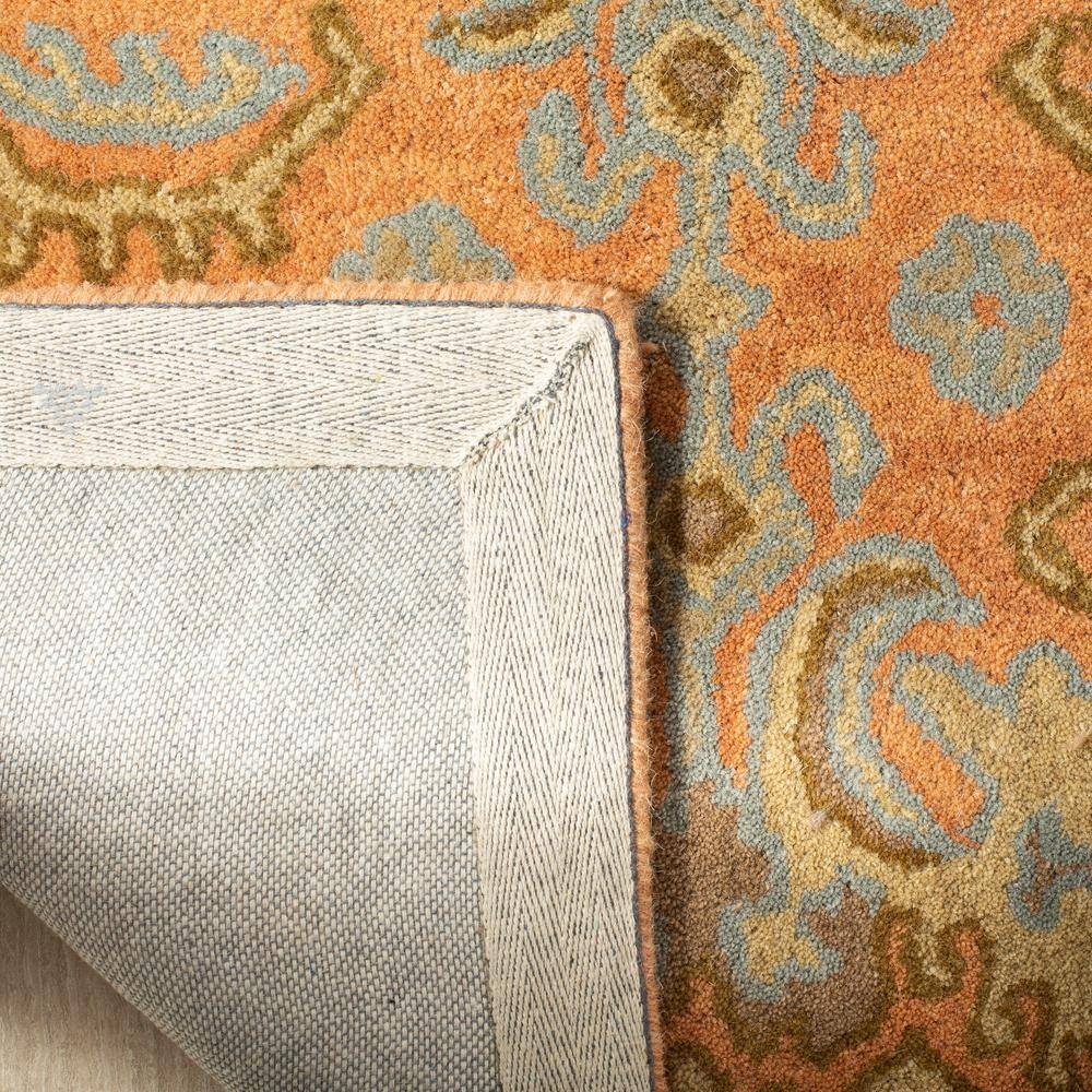 Handmade Light Blue and Terracotta Floral Wool Tufted Rug