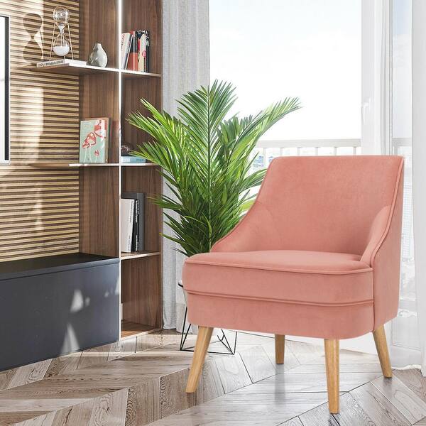 pink velvet chair with wooden legs