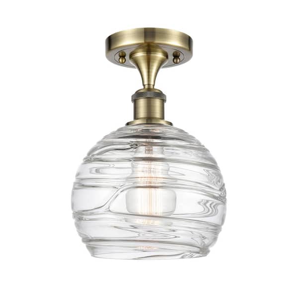 Innovations Athens Deco Swirl 8 in. 1-Light Antique Brass Semi-Flush Mount with Clear Deco Swirl Glass Shade