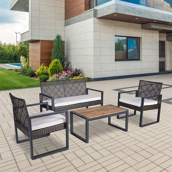 4-Piece Wicker Outdoor Patio Furniture Set with Acacia Wood Table Top and Beige Cushions