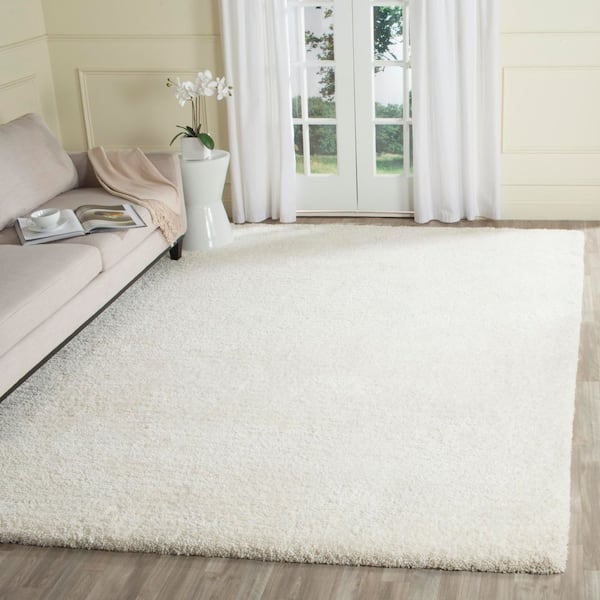 Ultimate Shag 9 ft. x 12 ft. Ivory Distressed Solid Color Area Rug