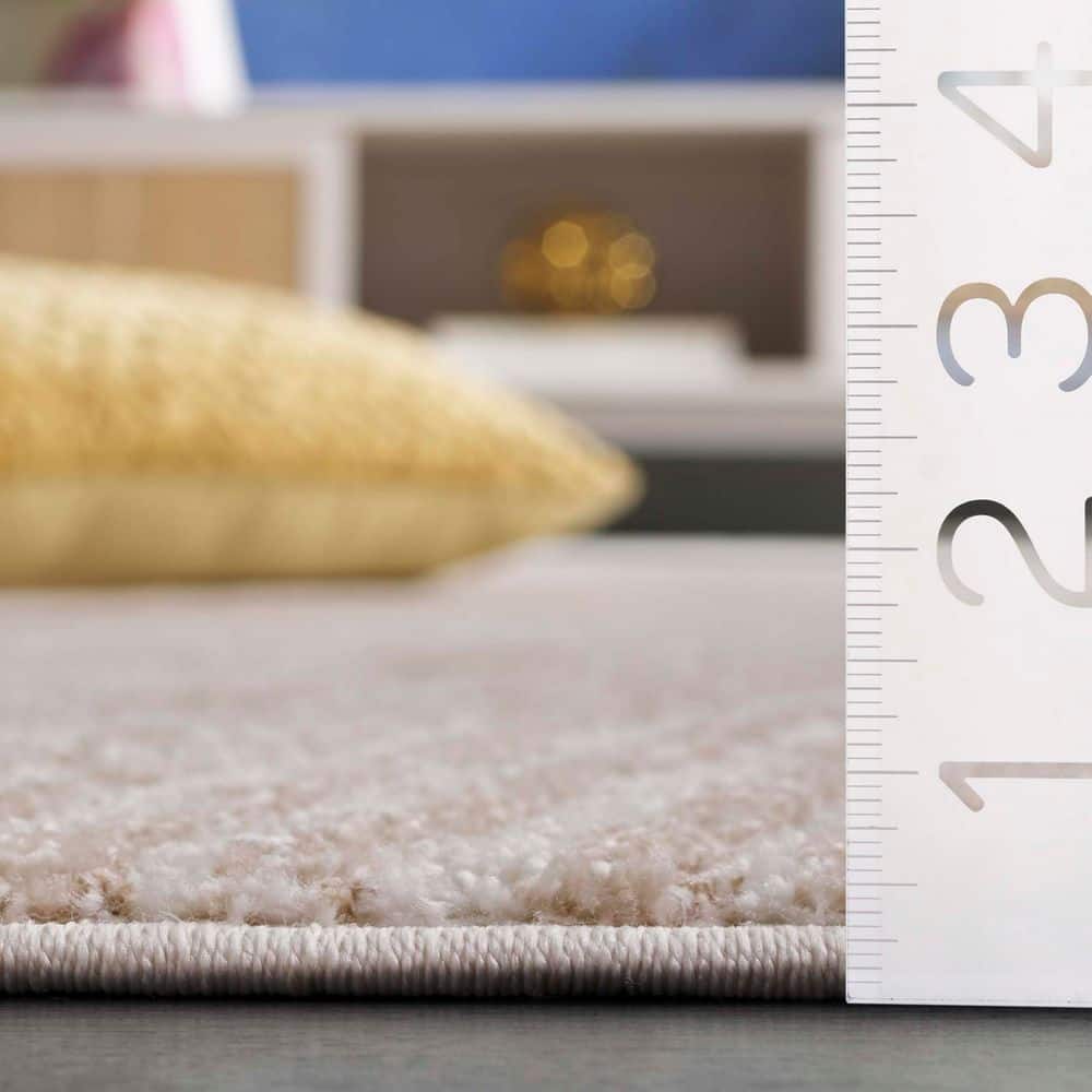 Ivory and Beige Rectangular Synthetic Area Rug, 4' x 6'