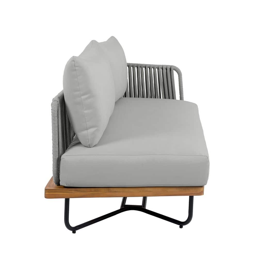 Side view of the Matilda Teak Outdoor Sectional Sofa with gray cushions.