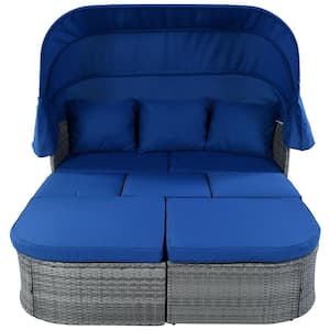 Gray Wicker Outdoor Day Bed with Blue Cushions and Retractable Canopy