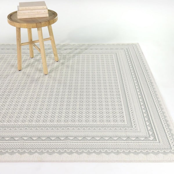 Delahunt Light Blue 5 ft. 3 in. x 7 ft. Micro Print Border Indoor/Outdoor Area Rug