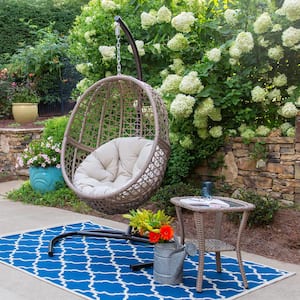 Rio Vista Hanging Sandstone Wicker Egg Chair Swing Patio Furniture Piece with Outdoor Side Table and Plush Beige Cushion