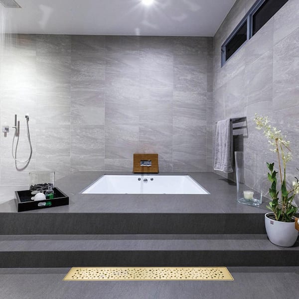 https://images.thdstatic.com/productImages/410d1277-cadd-459f-9cb2-e20e47af4b20/svn/zirconium-gold-plating-elegante-drain-collection-shower-drains-kd01a099-48-zgp-31_600.jpg