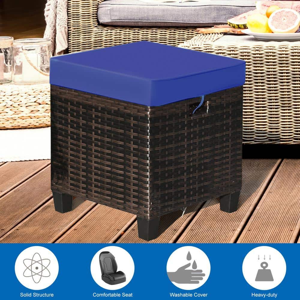 Wicker ottoman with navy cushion and feature icons.