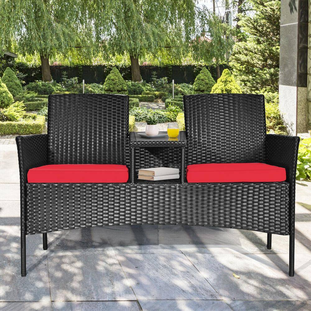 Compact Black Wicker Patio Loveseat with Red Cushions and Glass Table