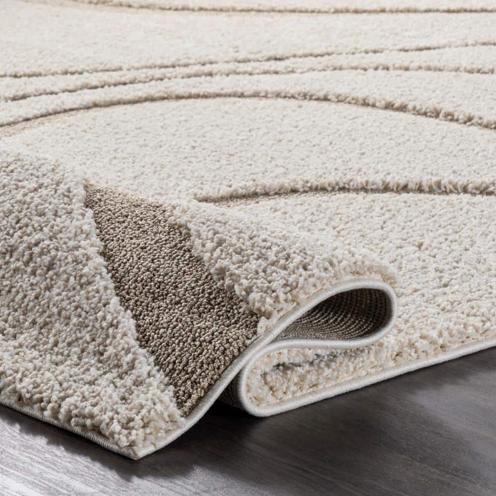 Carolyn Off-White Synthetic Tufted Shag Round Rug, 7' 10"