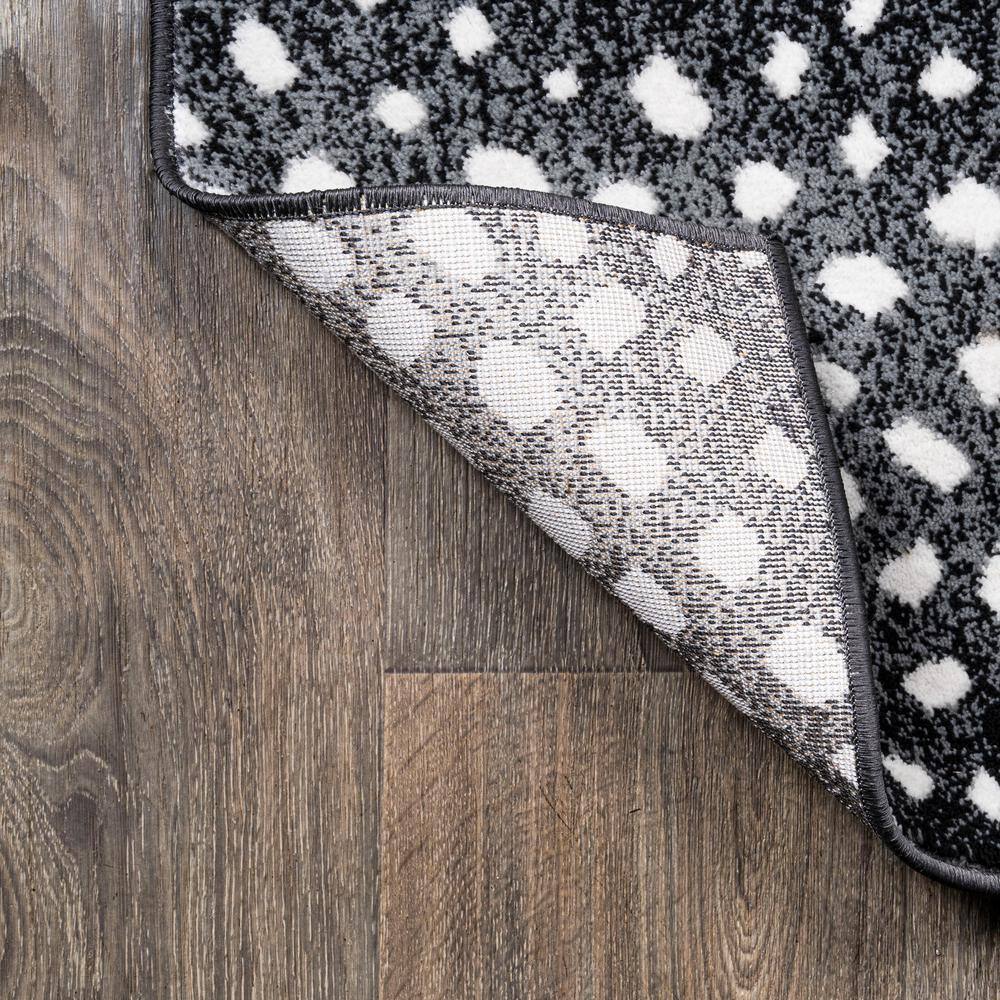 Abstract Antelope 8' x 10' Black and Ivory Synthetic Area Rug
