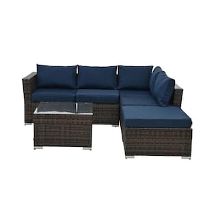 4-Piece Seasonal PE Wicker Outdoor Sectional Set with Tempered Glass Coffee Table and Dark Blue Cushions