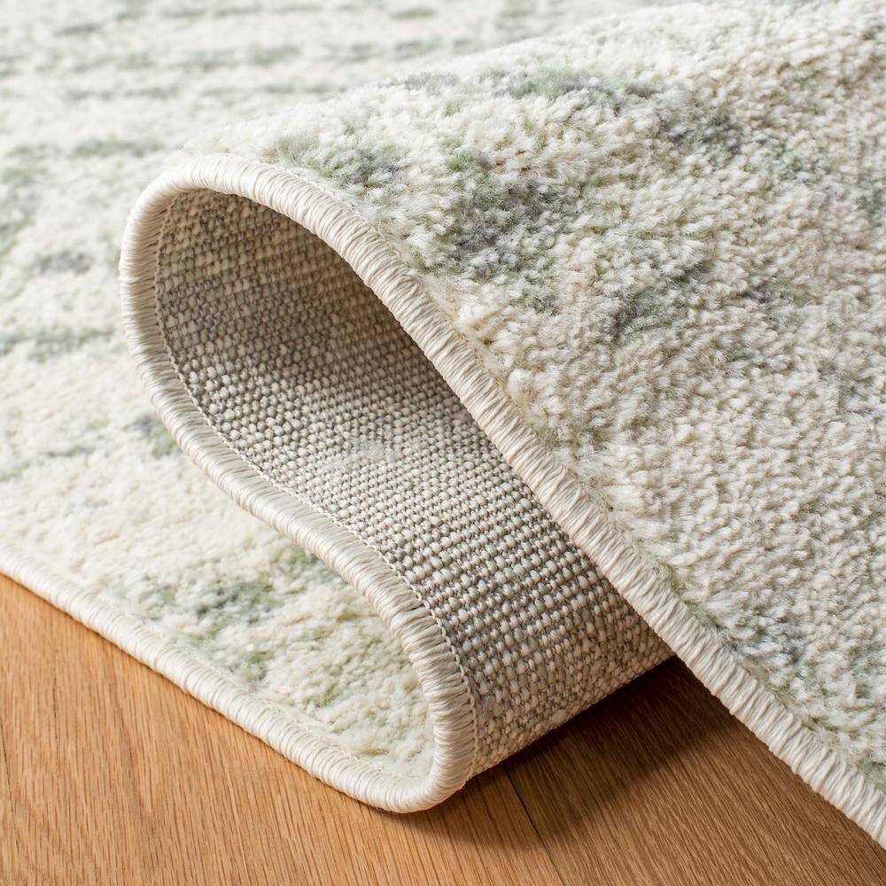Ivory and Green Geometric 10' x 14' Synthetic Area Rug