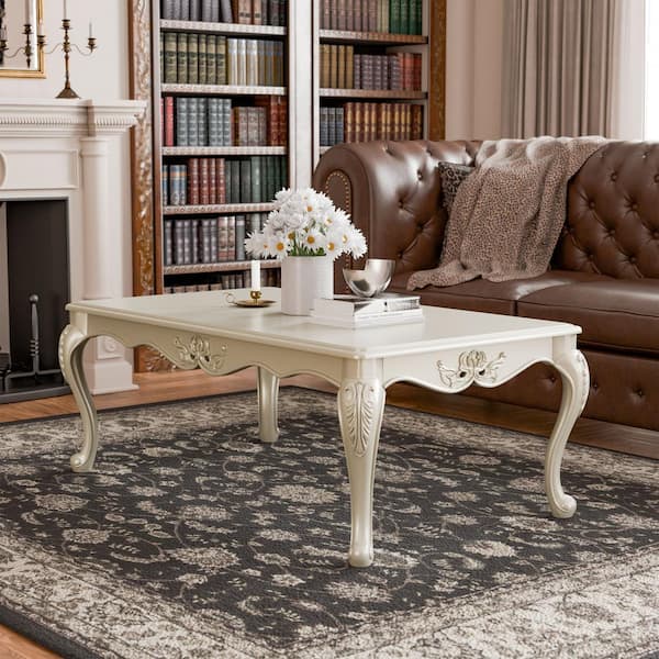 Griffith 53 in. Off White Rectangle Wood Coffee Table with Leaf Motifs