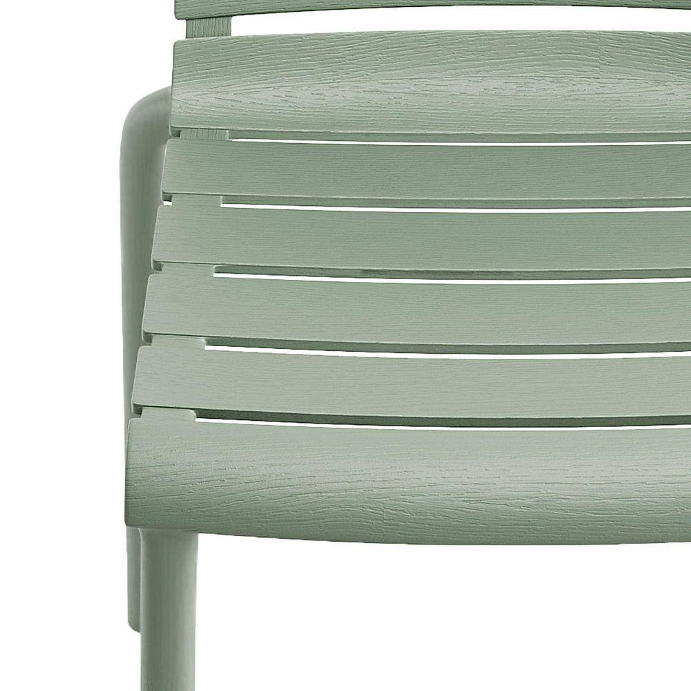 Close-up detail of the slatted backrest of an aloe green plastic chair.