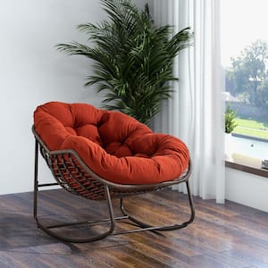 Oversized Wicker and Steel Frame Outdoor Rocking Chair with Padded Orange Cushion