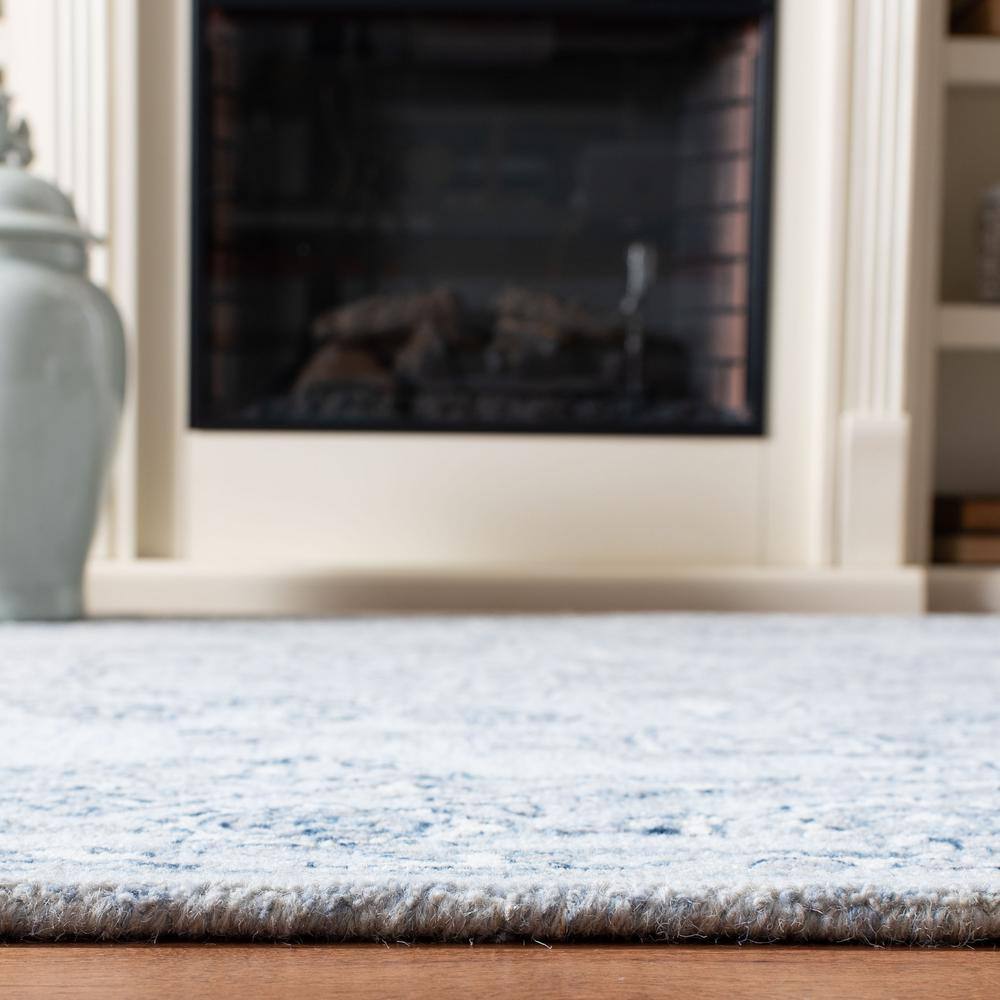 Handmade Tufted Wool Area Rug 9' x 12' in Light Blue and Ivory