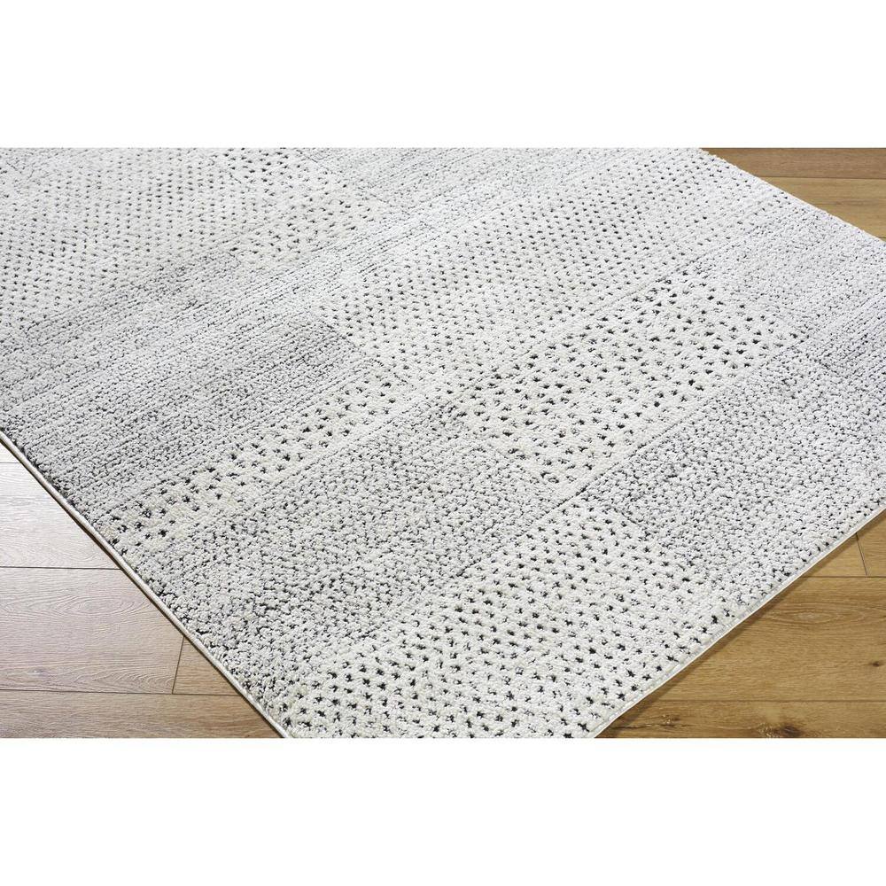 Livabliss 8' x 10' Ivory and Black Synthetic Patchwork Area Rug