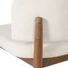 Close-up of the wooden frame and backrest of a bar stool.